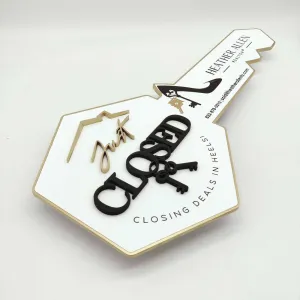 White Key-Shaped Sign "Closing deals in heels"