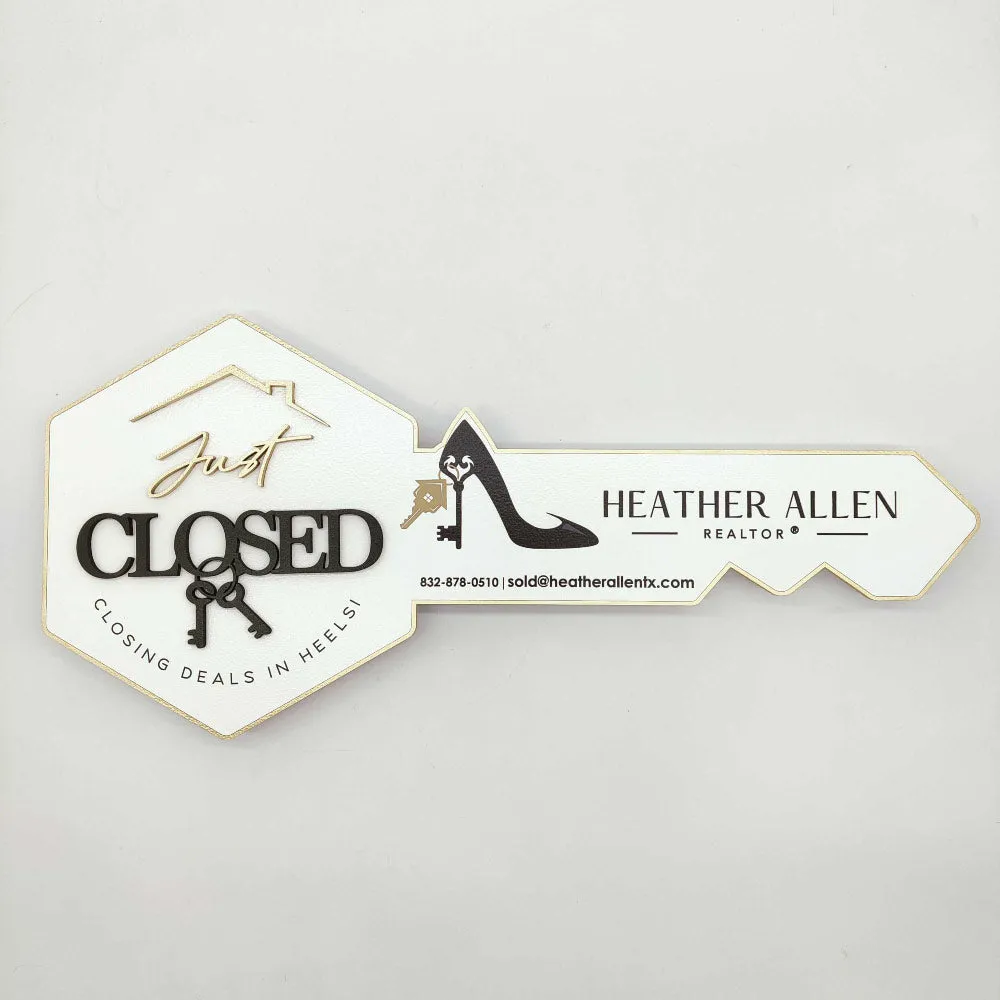 White Key-Shaped Sign "Closing deals in heels"